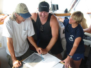 With archaeologist Jeff Johnston (NOAA) and diver Shelly Johnson examining USS Monitor illustrations.